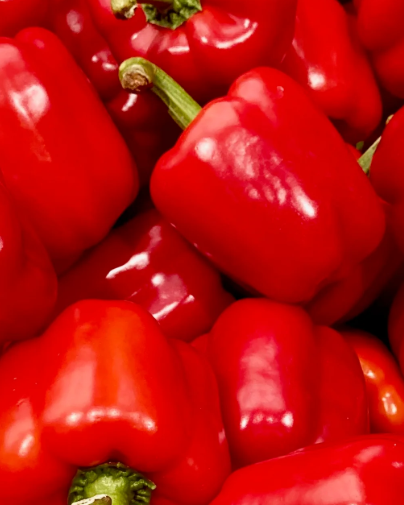 Close-up of red bell peppers with a focus on texture and color.